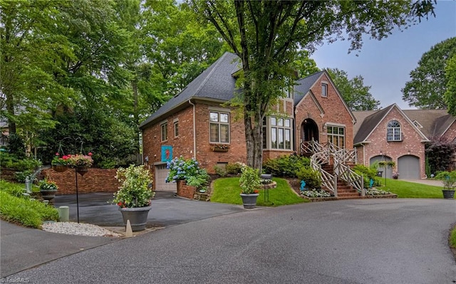 3705 Bradwyck Cir, Winston-Salem, NC 27104 - view of front of house featuring asphalt driveway, brick siding, and an attached garage