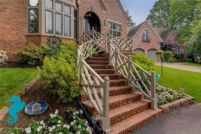 3705 Bradwyck Cir, Winston-Salem, NC 27104 - property entrance featuring brick siding, concrete driveway, and a lawn