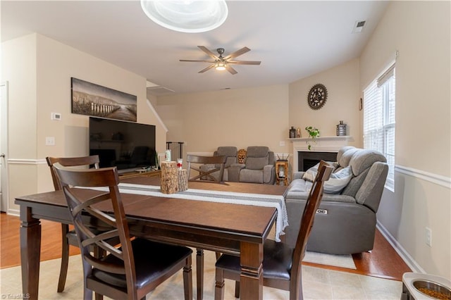 dining room featuring light hardwood / wood-style flooring and ceiling fan