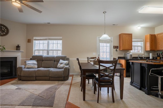 dining space with ceiling fan