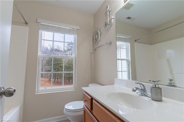 full bathroom featuring vanity, bathing tub / shower combination, and toilet