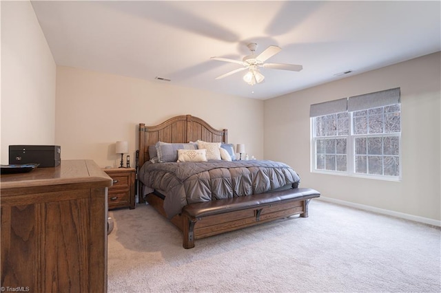 bedroom featuring light colored carpet and ceiling fan