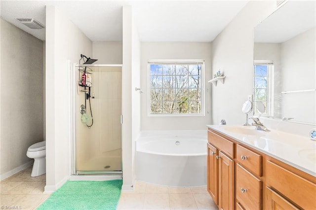 full bath with double vanity, visible vents, a sink, a shower stall, and a bath