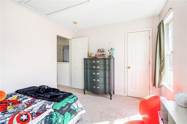 bedroom with light carpet and baseboards