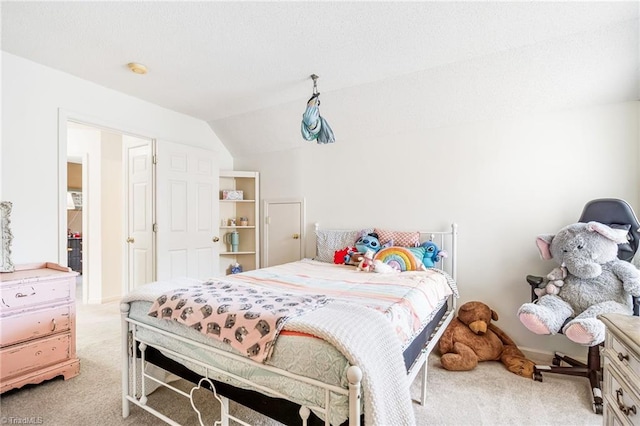 bedroom with light carpet and vaulted ceiling