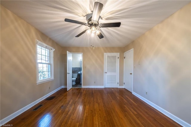 unfurnished bedroom featuring visible vents, baseboards, and hardwood / wood-style flooring