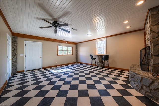 unfurnished room featuring crown molding and a healthy amount of sunlight