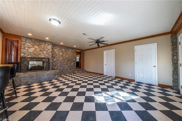 unfurnished living room featuring baseboards, a fireplace, ceiling fan, crown molding, and tile patterned floors