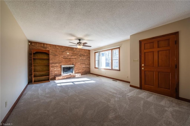 unfurnished living room with baseboards, carpet, ceiling fan, and a textured ceiling