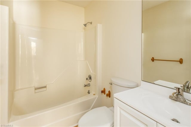 full bathroom with tub / shower combination, vanity, and toilet