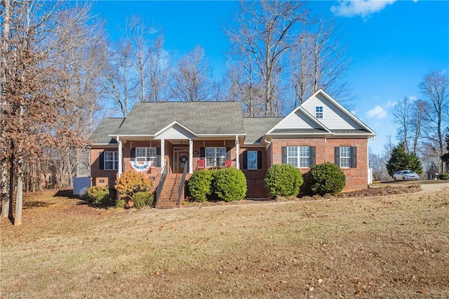 view of front facade featuring a front lawn and covered porch