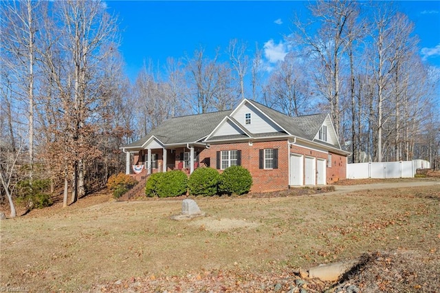 view of front of property with a garage and a front yard