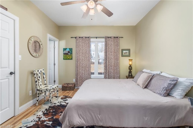 bedroom with ceiling fan and light wood-type flooring