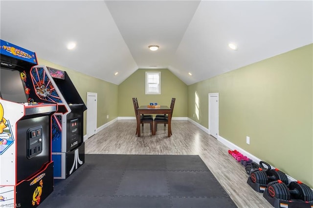 playroom with lofted ceiling and hardwood / wood-style floors