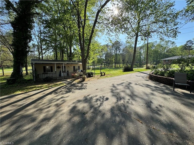 view of home's community featuring driveway