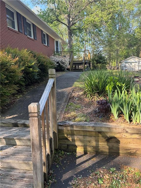 view of home's community featuring a wooden deck