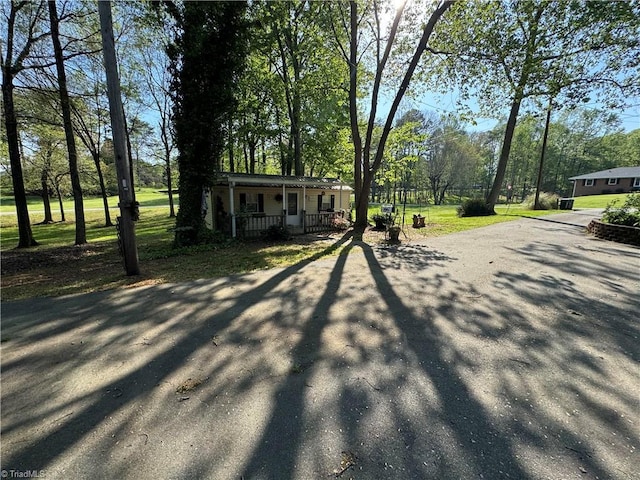 exterior space with covered porch and driveway