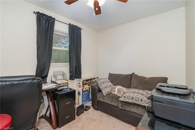 office area with light carpet and ceiling fan