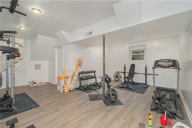 workout area featuring light wood-type flooring