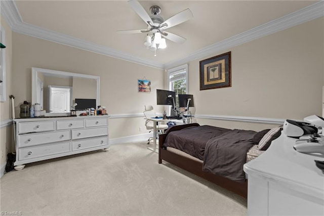 bedroom with ornamental molding, light colored carpet, an office area, baseboards, and ceiling fan