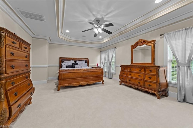 carpeted bedroom with ornamental molding, a raised ceiling, recessed lighting, baseboards, and ceiling fan