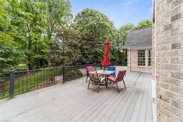 deck featuring outdoor dining area