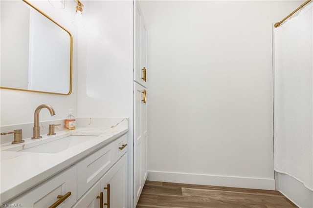 138 Arthur Needham Rd, Pilot Mountain, NC 27041 - bathroom with vanity, baseboards, and wood finished floors