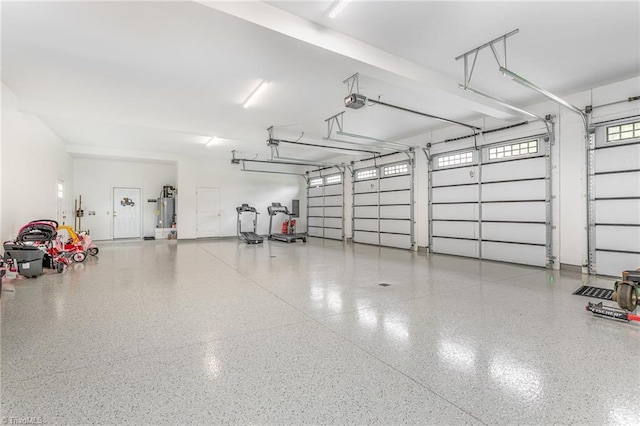 138 Arthur Needham Rd, Pilot Mountain, NC 27041 - garage featuring a garage door opener and water heater