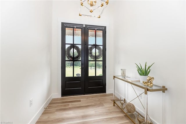 138 Arthur Needham Rd, Pilot Mountain, NC 27041 - foyer featuring french doors, plenty of natural light, a chandelier, and baseboards