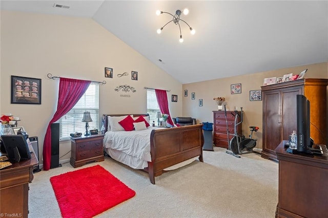 carpeted bedroom featuring an inviting chandelier and high vaulted ceiling