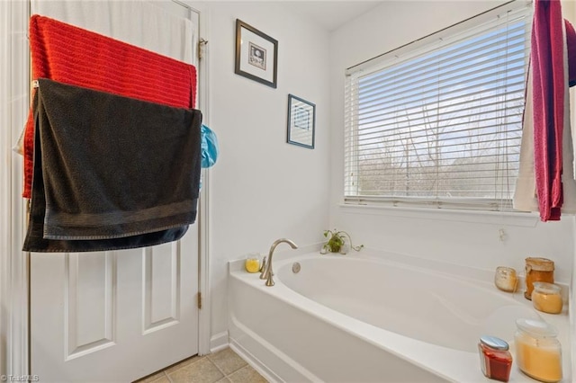 bathroom featuring tile patterned floors and a bathtub