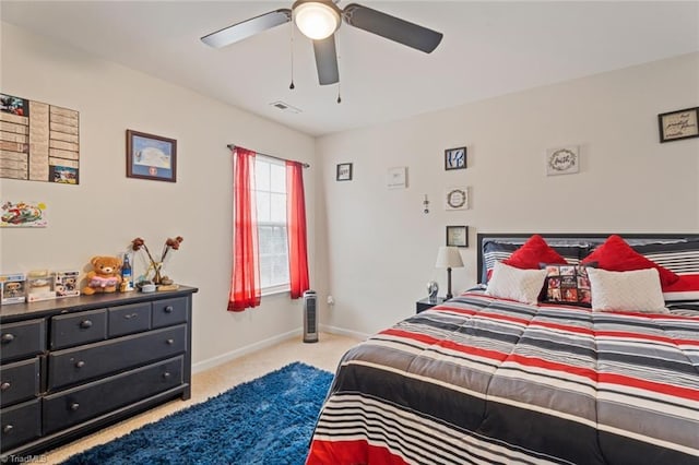 bedroom with light colored carpet and ceiling fan