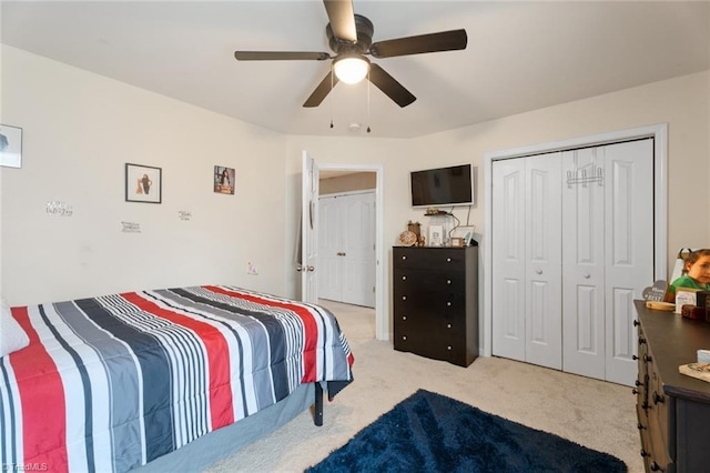 bedroom featuring light colored carpet and ceiling fan