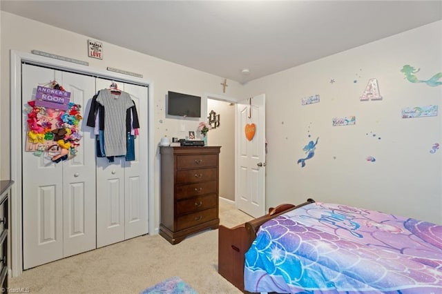 bedroom featuring light carpet and a closet