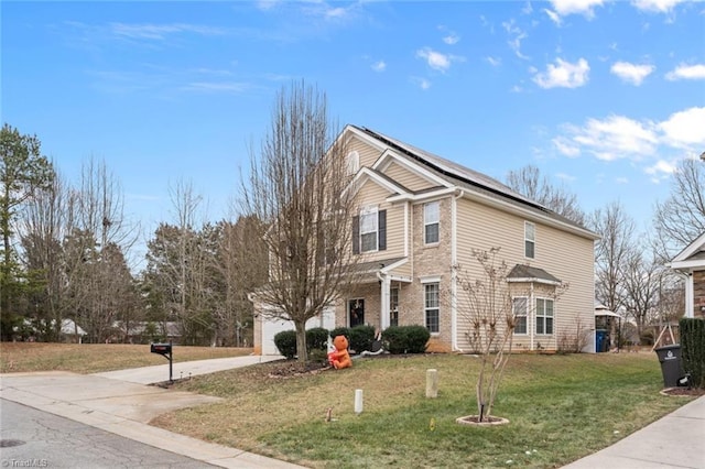 front of property featuring a garage and a front lawn