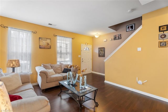 living room featuring dark wood-type flooring