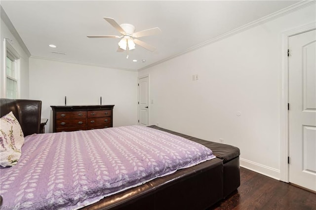 bedroom featuring baseboards, ceiling fan, crown molding, and wood finished floors