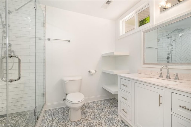 full bathroom featuring vanity, toilet, visible vents, and a stall shower
