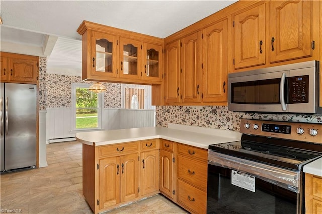 kitchen with kitchen peninsula, stainless steel appliances, and a baseboard heating unit