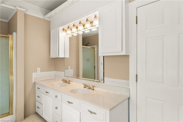 bathroom with tile patterned flooring, vanity, and an enclosed shower