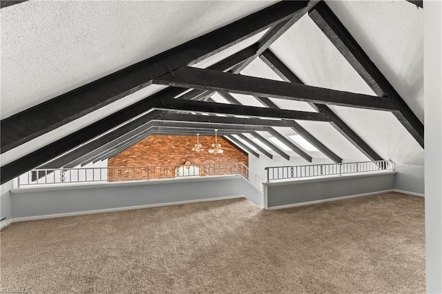 bonus room with vaulted ceiling with beams, plenty of natural light, carpet floors, and a textured ceiling