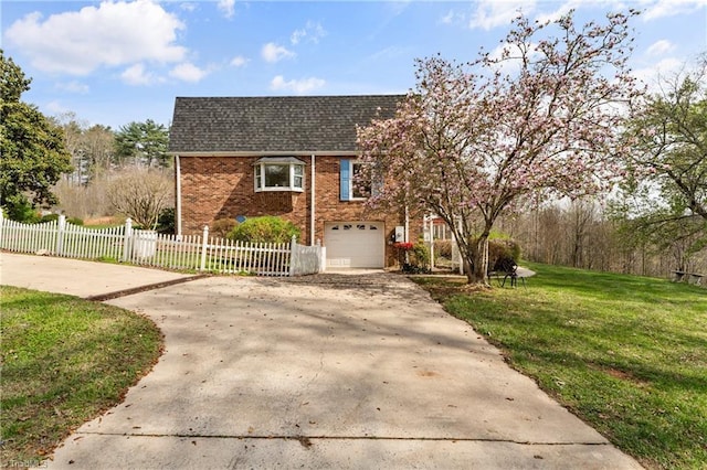 view of front of home with a front lawn and a garage