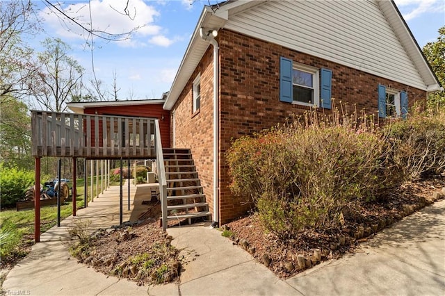 view of home's exterior with a wooden deck