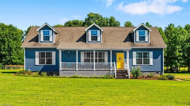 6770 Cotton Rd, Gibsonville, NC 27249 - new england style home with a porch, crawl space, and a front lawn