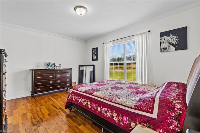 6770 Cotton Rd, Gibsonville, NC 27249 - bedroom with crown molding and wood finished floors