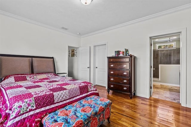 6770 Cotton Rd, Gibsonville, NC 27249 - bedroom with wood finished floors and crown molding