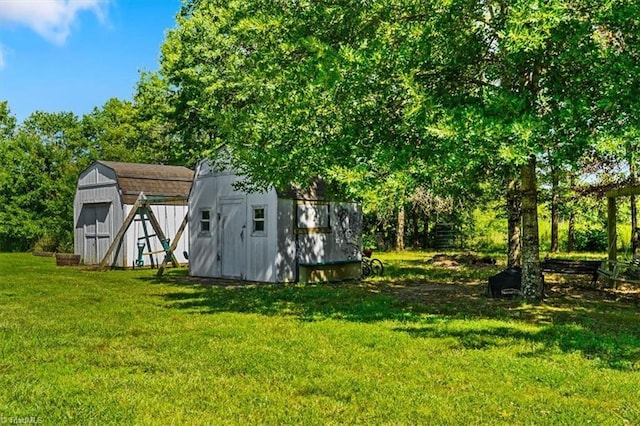 6770 Cotton Rd, Gibsonville, NC 27249 - view of green lawn with a shed