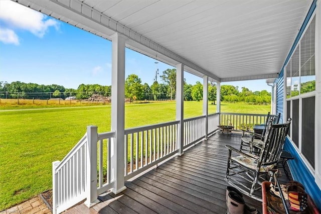 6770 Cotton Rd, Gibsonville, NC 27249 - wooden porch with view of scattered trees and a yard