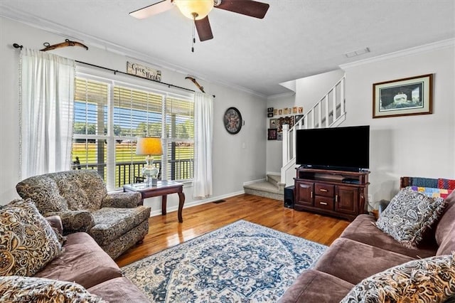 6770 Cotton Rd, Gibsonville, NC 27249 - living room featuring stairway, ornamental molding, ceiling fan, and wood finished floors