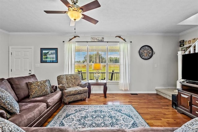 6770 Cotton Rd, Gibsonville, NC 27249 - living area with wood finished floors, crown molding, and ceiling fan